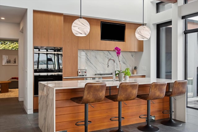 61 Harbor Dr, Sag Harbor, NY 11963 - kitchen with light countertops, modern cabinets, pendant lighting, and recessed lighting