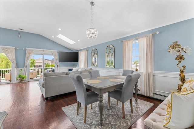 845 Atlantic St, Lindenhurst, NY 11757 - dining space featuring a skylight, wainscoting, lofted ceiling, a chandelier, and wood finished floors