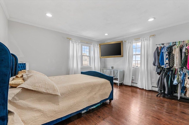 845 Atlantic St, Lindenhurst, NY 11757 - bedroom with wood finished floors, ornamental molding, recessed lighting, and baseboard heating