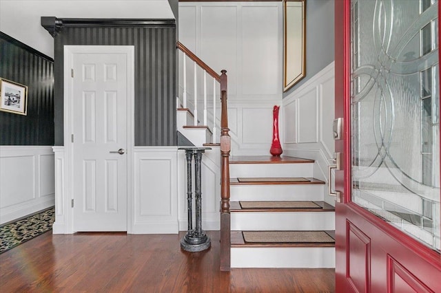 845 Atlantic St, Lindenhurst, NY 11757 - stairway featuring a decorative wall, a wainscoted wall, and wood finished floors
