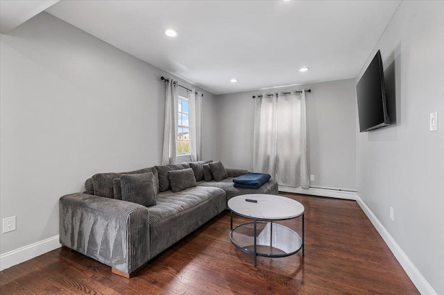 845 Atlantic St, Lindenhurst, NY 11757 - living room featuring a baseboard heating unit, wood finished floors, baseboards, and recessed lighting
