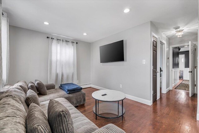 845 Atlantic St, Lindenhurst, NY 11757 - living area with a baseboard radiator, dark wood-style floors, baseboards, and recessed lighting