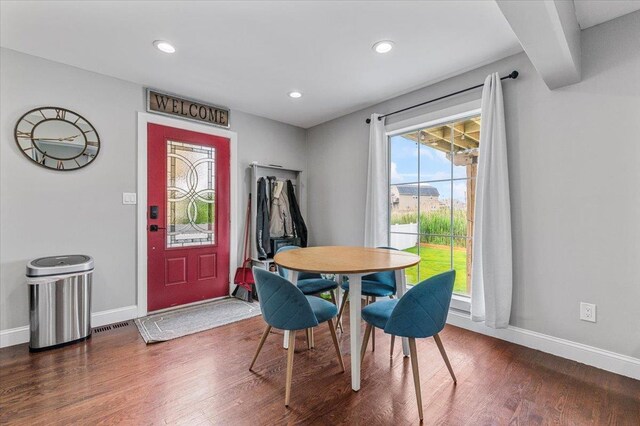 845 Atlantic St, Lindenhurst, NY 11757 - dining room featuring dark wood-type flooring, baseboards, and recessed lighting