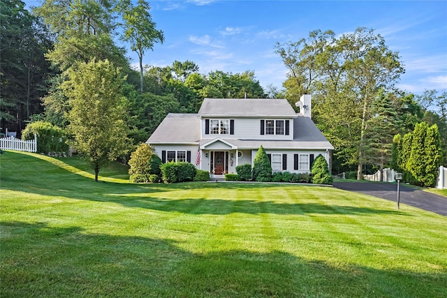 3856 Marcy St, Mohegan Lake, NY 10547 - view of front facade featuring a chimney and asphalt driveway