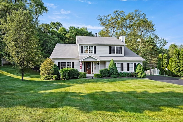 3856 Marcy St, Mohegan Lake, NY 10547 - view of front of property with a front lawn and a chimney