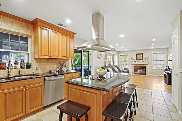 3856 Marcy St, Mohegan Lake, NY 10547 - kitchen featuring dishwasher, island range hood, a kitchen bar, a kitchen island, and dark stone countertops