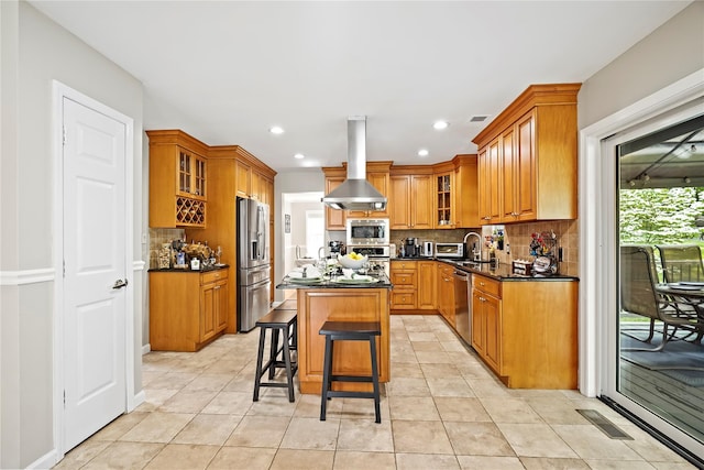 3856 Marcy St, Mohegan Lake, NY 10547 - kitchen with island range hood, appliances with stainless steel finishes, decorative backsplash, a kitchen island, and recessed lighting