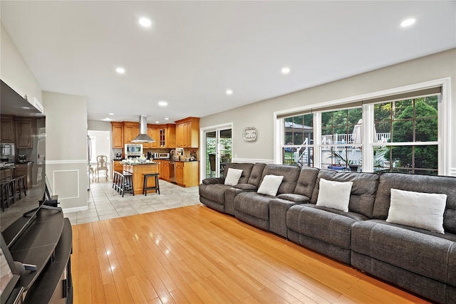 3856 Marcy St, Mohegan Lake, NY 10547 - living area featuring recessed lighting, a wainscoted wall, and light wood-style floors