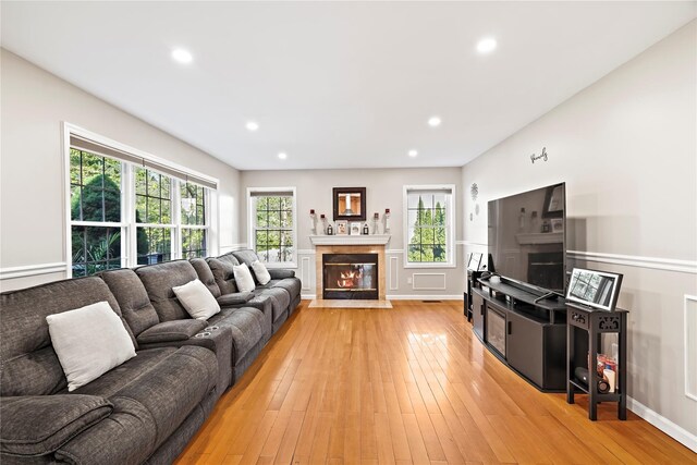 3856 Marcy St, Mohegan Lake, NY 10547 - living area with a fireplace with flush hearth, light wood-type flooring, and recessed lighting