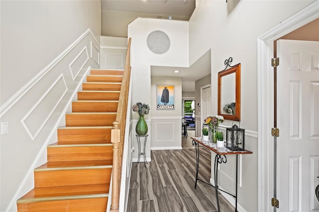 3856 Marcy St, Mohegan Lake, NY 10547 - stairs featuring a decorative wall, a wainscoted wall, and wood finished floors