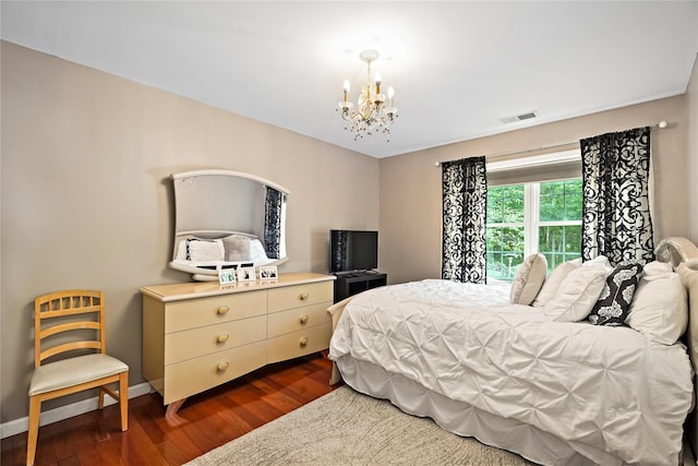 3856 Marcy St, Mohegan Lake, NY 10547 - bedroom featuring a chandelier and dark wood finished floors