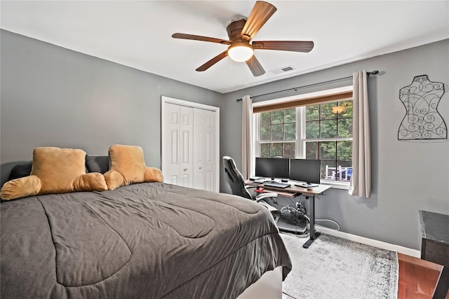 3856 Marcy St, Mohegan Lake, NY 10547 - bedroom featuring a closet, a desk, a ceiling fan, and wood finished floors