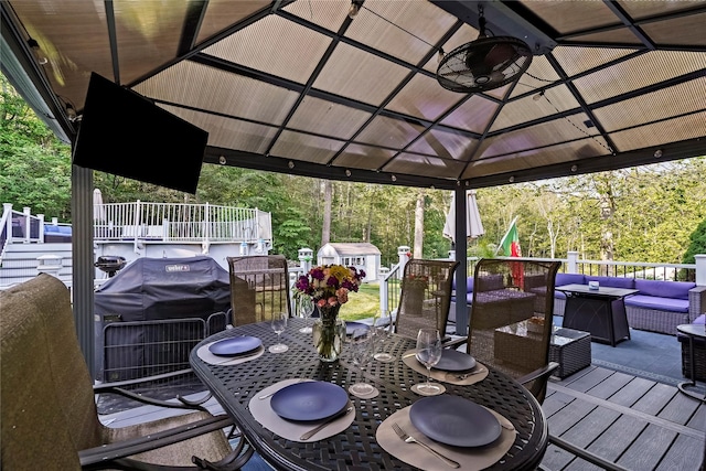3856 Marcy St, Mohegan Lake, NY 10547 - deck with a gazebo, an outdoor hangout area, outdoor dining space, a storage shed, and ceiling fan