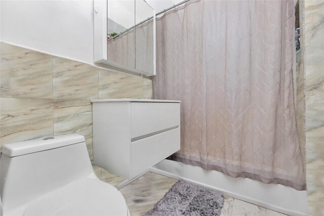 6018 Bleecker St, Ridgewood, NY 11385 - full bath with shower / tub combo with curtain, tile walls, and toilet