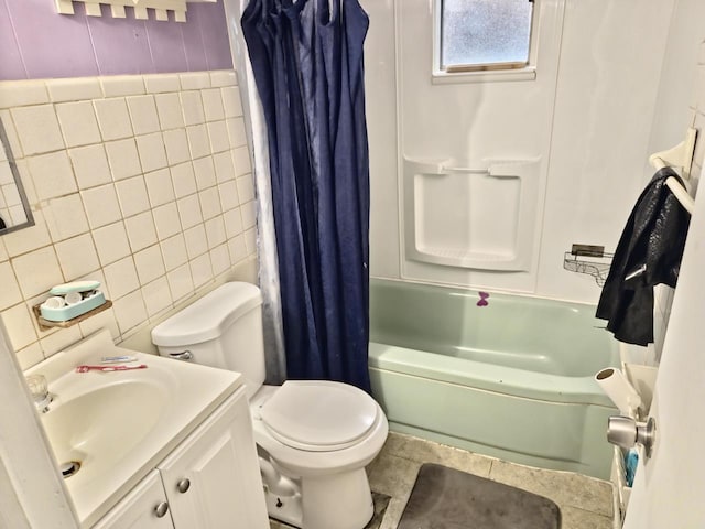 24 E Oakdale St, Bay Shore, NY 11706 - full bathroom with tile walls, vanity, shower / bath combo, and tile patterned flooring