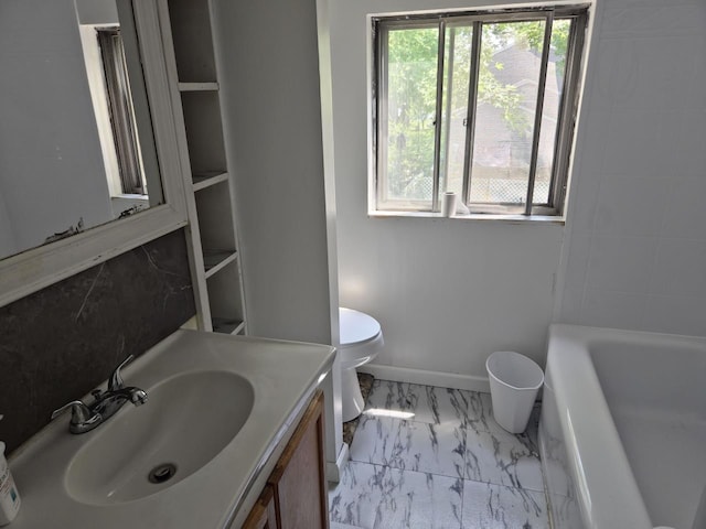 24 E Oakdale St, Bay Shore, NY 11706 - full bathroom with marble look tile flooring, vanity, and a tub