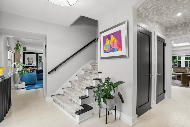 71 Baraud Rd S, Scarsdale, NY 10583 - stairs featuring wood finished floors and baseboards