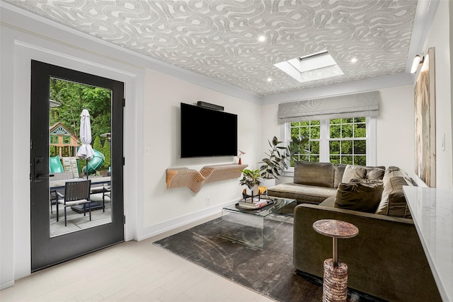 71 Baraud Rd S, Scarsdale, NY 10583 - living room with a skylight, plenty of natural light, an ornate ceiling, wood finished floors, and crown molding