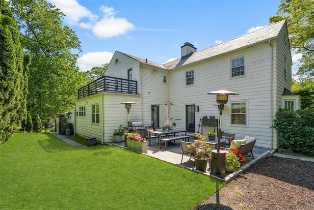 71 Baraud Rd S, Scarsdale, NY 10583 - rear view of property with an outdoor living space, a yard, a balcony, a patio area, and a chimney