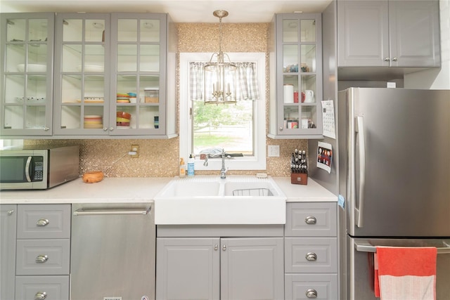 2 Sheafe Cir, Rock Tavern, NY 12575 - kitchen featuring appliances with stainless steel finishes, a sink, tasteful backsplash, and a chandelier
