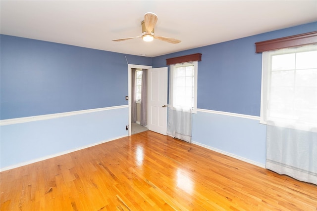 2 Sheafe Cir, Rock Tavern, NY 12575 - empty room with healthy amount of natural light, wood finished floors, ceiling fan, and baseboards