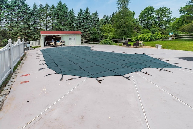 2 Sheafe Cir, Rock Tavern, NY 12575 - view of swimming pool with a patio, an outdoor structure, and view of scattered trees
