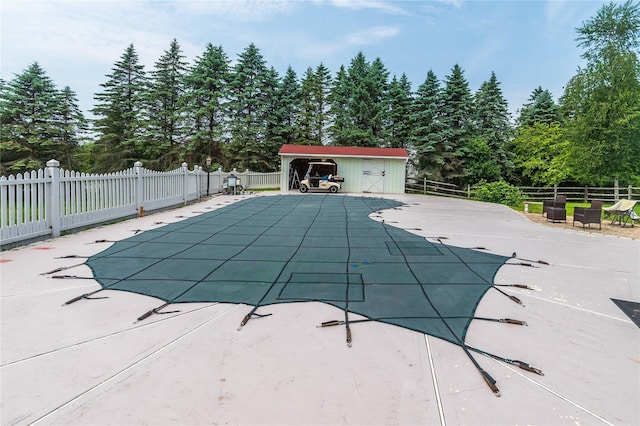 2 Sheafe Cir, Rock Tavern, NY 12575 - view of swimming pool with a patio area and view of wooded area