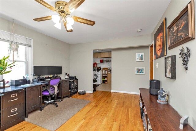8 Trumpet Ln, Levittown, NY 11756 - home office featuring washer / clothes dryer, a ceiling fan, light wood-type flooring, and baseboards