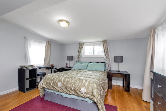8 Trumpet Ln, Levittown, NY 11756 - bedroom featuring light wood-style floors and baseboards