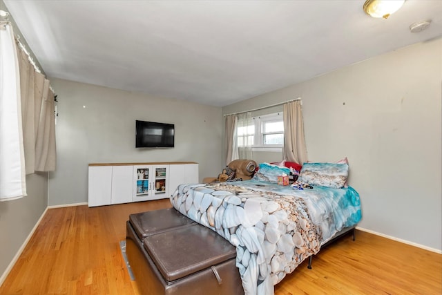 8 Trumpet Ln, Levittown, NY 11756 - bedroom featuring wood finished floors and baseboards