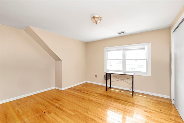 8 Trumpet Ln, Levittown, NY 11756 - unfurnished bedroom with light wood-type flooring, baseboards, and a closet