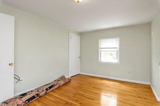 8 Trumpet Ln, Levittown, NY 11756 - empty room featuring light wood-style floors and baseboards