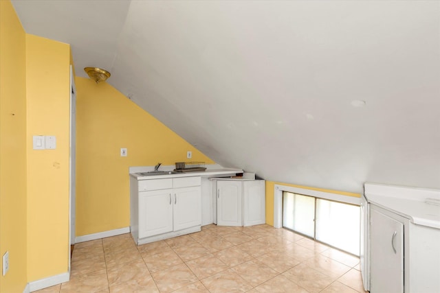 8 Trumpet Ln, Levittown, NY 11756 - additional living space featuring lofted ceiling, a sink, and light tile patterned floors