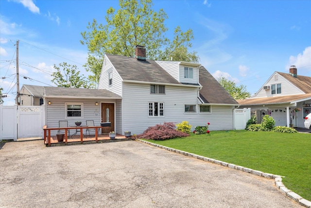 8 Trumpet Ln, Levittown, NY 11756 - view of front of home with a gate, a wooden deck, a shingled roof, and a chimney