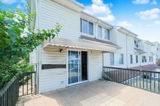 293 Wingham St, Staten Island, NY 10303 - rear view of house featuring a balcony