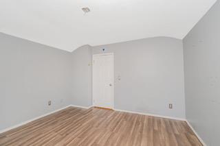 293 Wingham St, Staten Island, NY 10303 - spare room featuring baseboards, wood finished floors, and vaulted ceiling