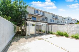 293 Wingham St, Staten Island, NY 10303 - back of property featuring a residential view and a patio