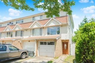 293 Wingham St, Staten Island, NY 10303 - multi unit property with an attached garage and driveway
