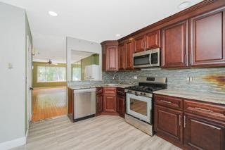 293 Wingham St, Staten Island, NY 10303 - kitchen featuring stainless steel appliances, backsplash, light countertops, light wood-type flooring, and recessed lighting