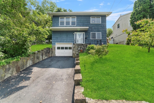 102 Maple St, Croton-On-Hudson, NY 10520 - view of front of home featuring driveway, a garage, and a front yard