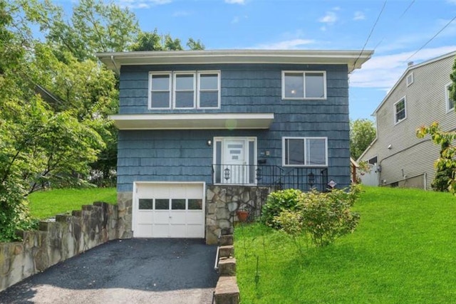 102 Maple St, Croton-On-Hudson, NY 10520 - view of front of property with an attached garage, driveway, a front lawn, and stone siding