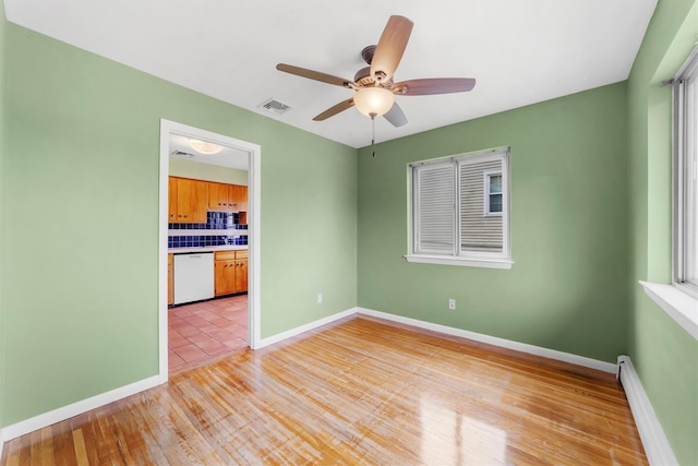 102 Maple St, Croton-On-Hudson, NY 10520 - empty room featuring a baseboard heating unit, ceiling fan, and light wood finished floors