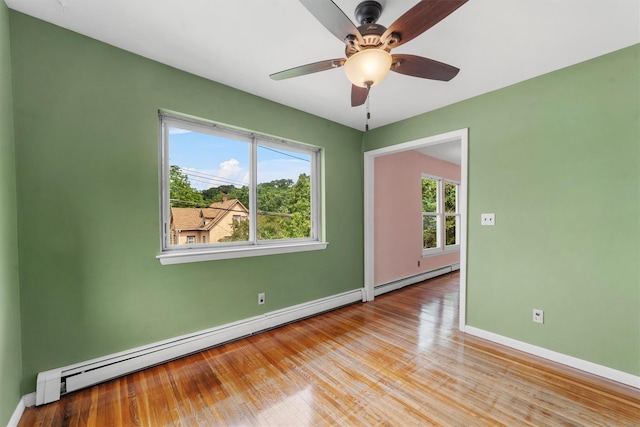 102 Maple St, Croton-On-Hudson, NY 10520 - unfurnished room featuring baseboard heating, plenty of natural light, and light wood-type flooring