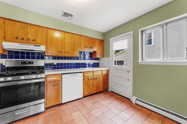 102 Maple St, Croton-On-Hudson, NY 10520 - kitchen with dishwasher, gas range, under cabinet range hood, a baseboard heating unit, and backsplash