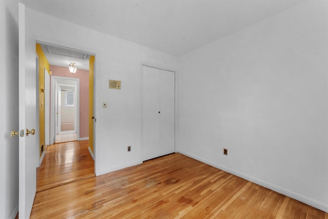 102 Maple St, Croton-On-Hudson, NY 10520 - unfurnished bedroom featuring attic access, light wood-style floors, and a closet
