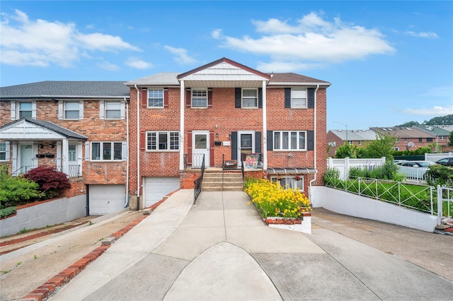 239-53 66th Ave, Little Neck, NY 11362 - multi unit property featuring driveway, a garage, brick siding, and a residential view