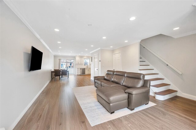 239-53 66th Ave, Little Neck, NY 11362 - living room featuring recessed lighting, crown molding, baseboards, light wood-type flooring, and stairway