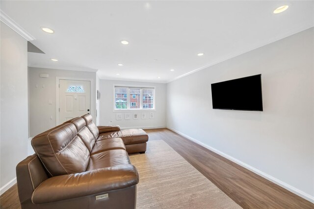 239-53 66th Ave, Little Neck, NY 11362 - living area with wood finished floors, ornamental molding, baseboards, and recessed lighting