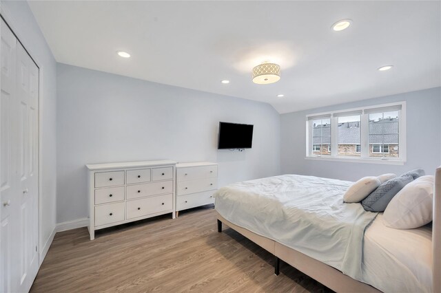 239-53 66th Ave, Little Neck, NY 11362 - bedroom featuring light wood-style floors, recessed lighting, baseboards, and a closet