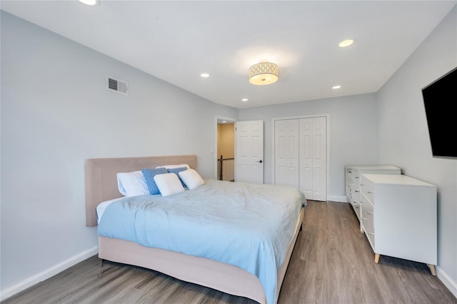 239-53 66th Ave, Little Neck, NY 11362 - bedroom featuring wood finished floors, baseboards, a closet, and recessed lighting